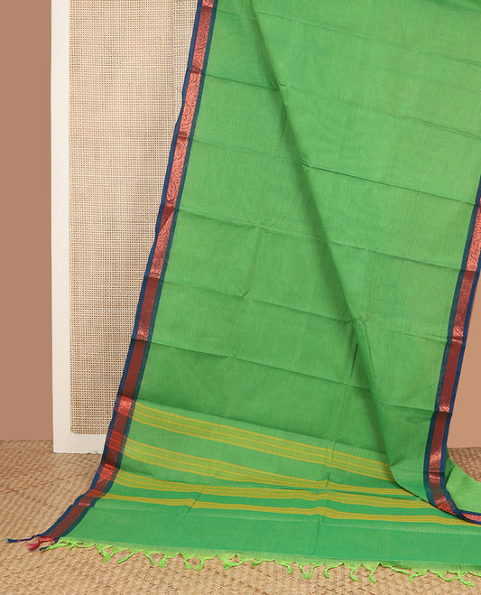Parrot green plain design Chettinad cotton saree, contrast floral creeper zari border & striped pallu
