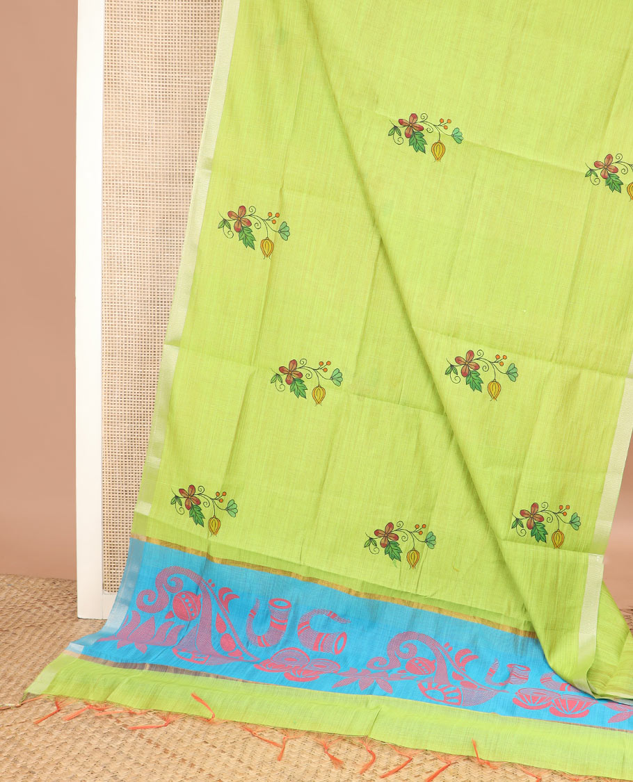 Green kathakali buttas printed chirala cotton saree, bavanji border, and contrast musical motifs print pallu