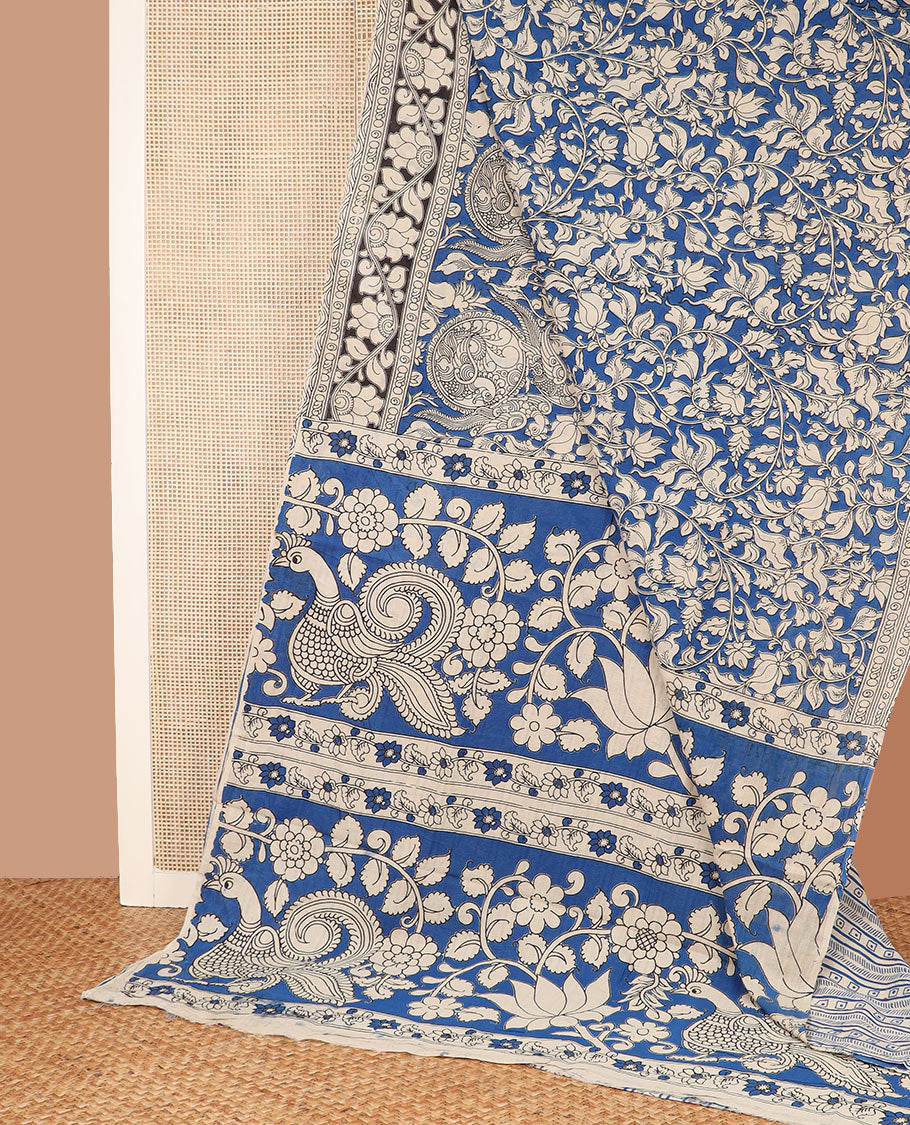 Blue floral and bird motifs machine-printed kalamkari cotton saree, contrast floral creeper border, and pallu of floral and peacock print