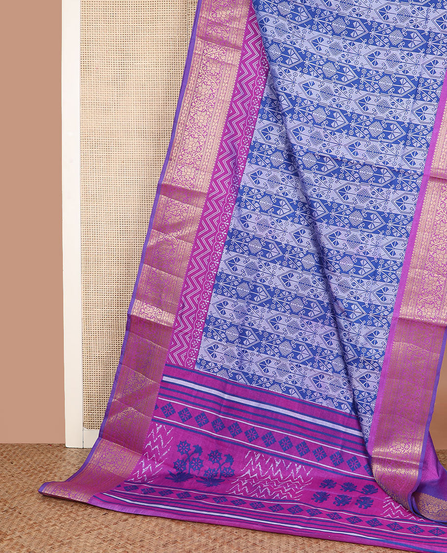 Blue intricately designed semi-banaras patola silk saree, contrast floral creeper zari design border, and pallu of chevron and floral designs
