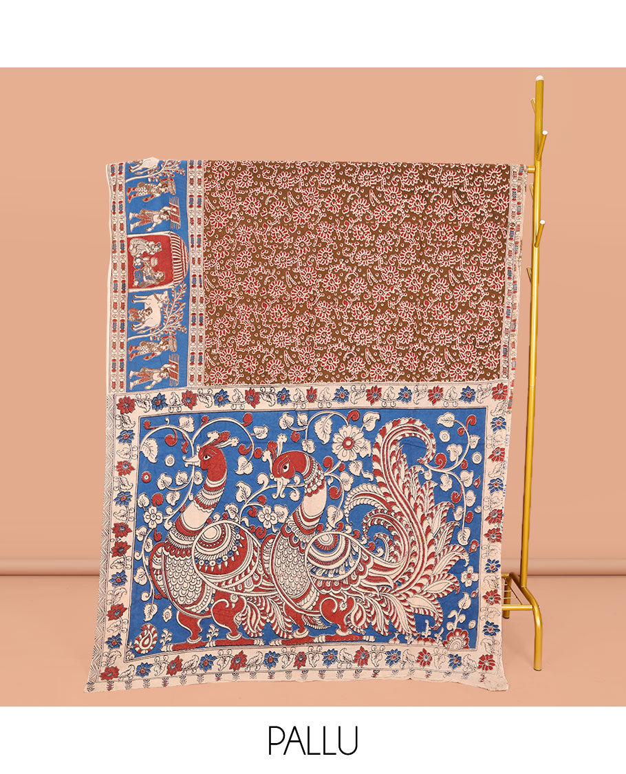 Brown Machine-Printed Kalamkari Cotton Saree, Accentuated with Floral Motifs on Its Body, Complemented by a Contrast Village-Theme Printed Border, Pallu of Peacock Motifs Print, and Paired with a Printed Blouse