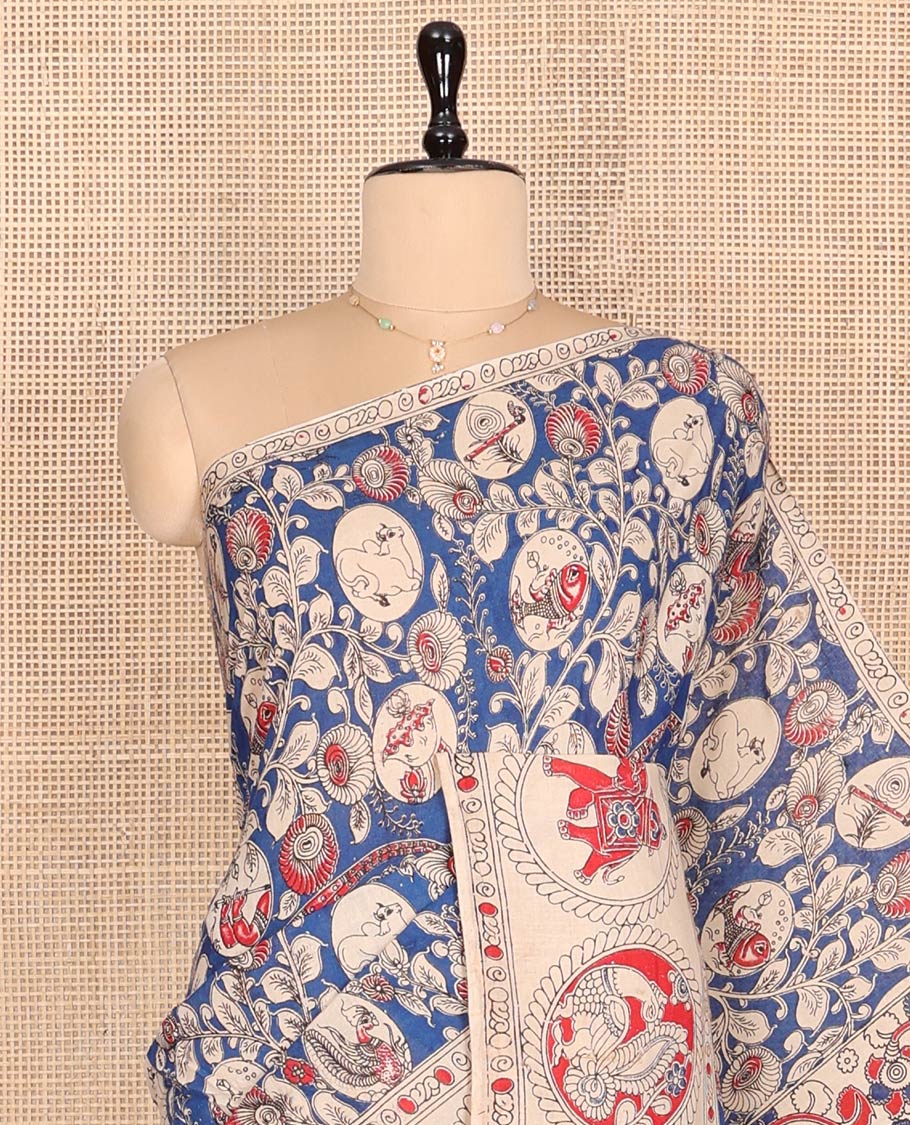 Blue Machine-Printed Kalamkari Cotton Saree, Detailed with Flora-Fauna Motifs, a Round Motifs Printed Border, Peacock Printed Pallu, and a Contrast Blouse