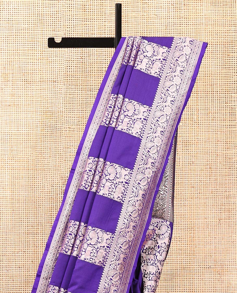 Blue Mushuru Silk Saree, Elegantly Decked Up with Vertically Woven Flora-Fauna Zari Designs On Its Body, Highlighted by Zari Border of Peacock and Deer Motifs, Grand Pallu, and Paired with a Plain Blouse