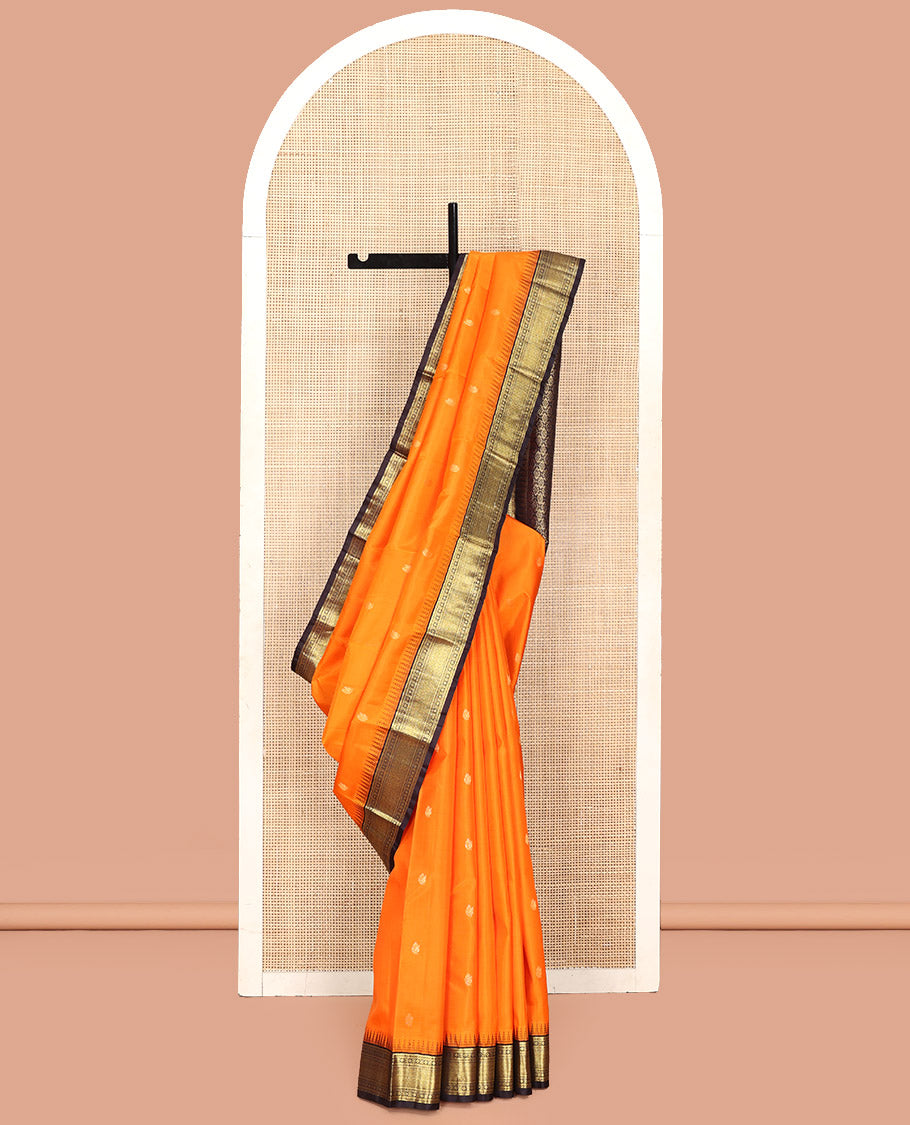 Orange Vasundhara Silk Saree, Artfully Woven with Mayil Buttas All Over Its Body, Complemented by Contrast Border Featuring Thazampoo Rekku, Muthu, Lavangam, and Mayil Kann Designs, a Grand Pallu of Jaal Designs, and Paired with a Contrast Blouse