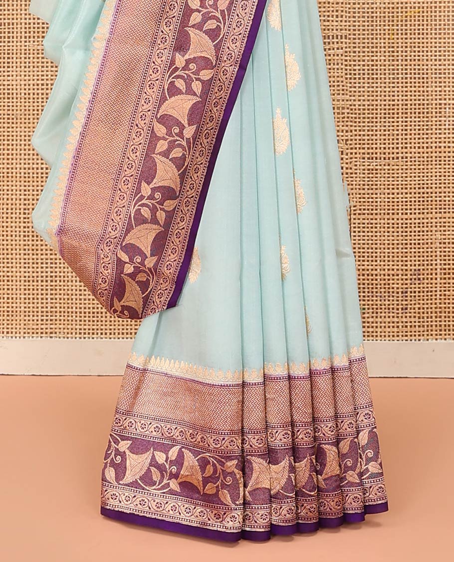 Baby Blue Raw Mango Silk Saree Subtly Sparked with Buttas, Complemented by a Contrast Traditional Zari-Designed Border, Featuring a Zari-Elevated Jaal-Designed Pallu, Paired with a Contrast Blouse