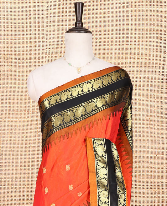 Orange Gadwal Silk Saree, Embellished with Peacock Buttas, Complemented by a Contrast Peacock Motifs Woven Temple Border, Grand Jaal Pallu, and a Contrast Blouse