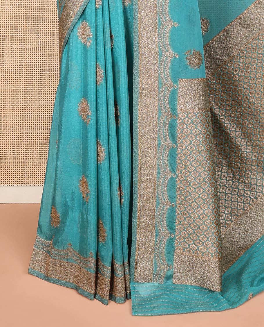 Blue Fancy Georgette Saree Sparsely Sparkled with Zari Buttas, Hazily Zari Woven Border of Scallop Designs, Zari Woven Pallu of Ogee Patterns, and Paired with a Matching Blouse