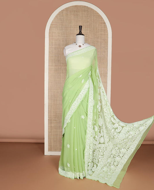 Light green floral motifs embroidery georgette saree with self embroidered border & floral thread embroidery pallu