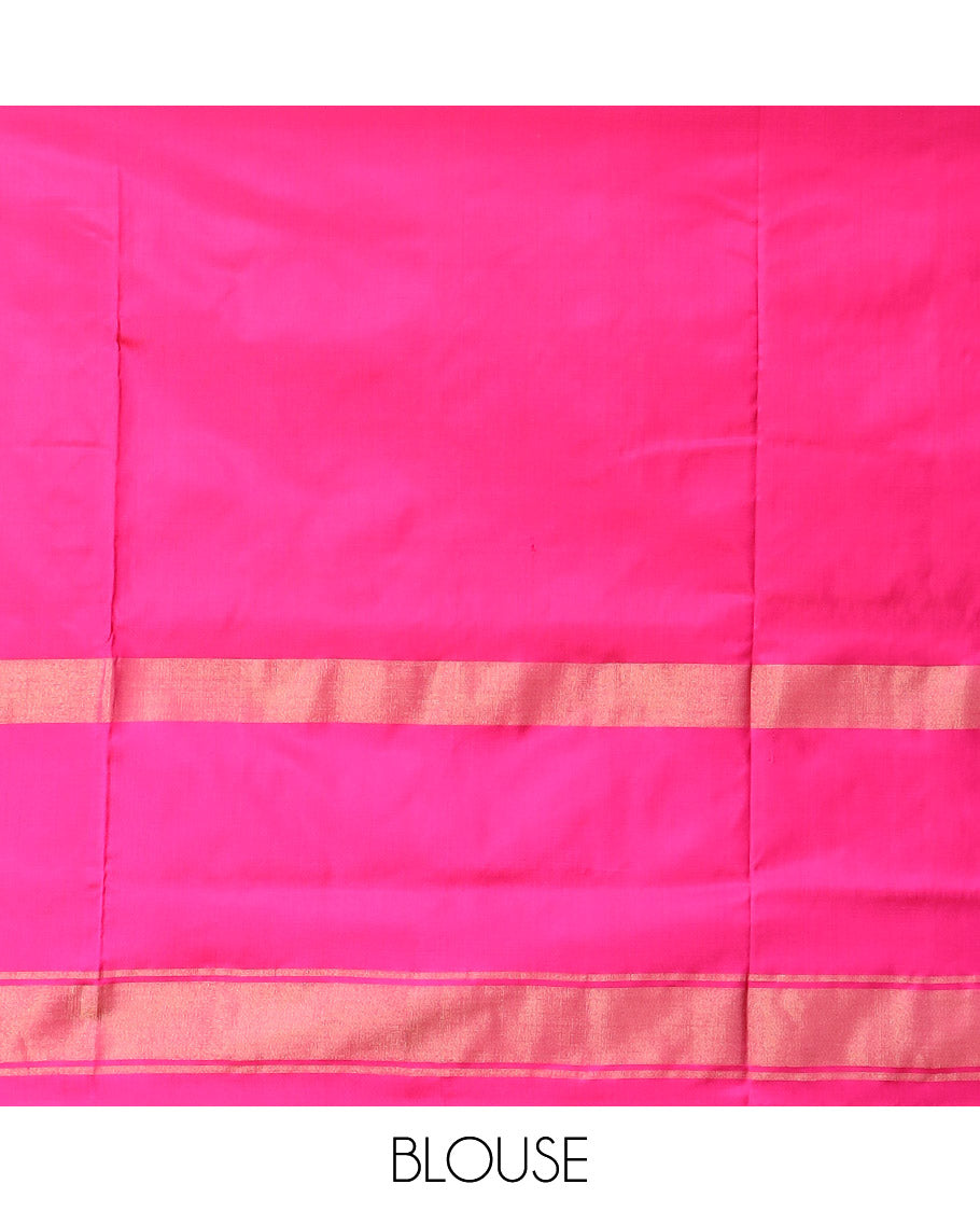 Green Ikkat silk saree features floral Ikkat buttas, highlighted with a contrast Ikkat woven border, a hazily woven Ikkat patterned pallu, and a contrast blouse