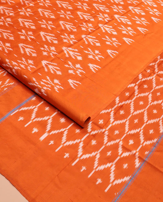 Orange Ikkat Silk Saree Decked with Ikkat Buttas, Featuring a Subtle Plain Border, Complemented by a Pallu Woven in an Ogee Pattern with Ikkat Texture