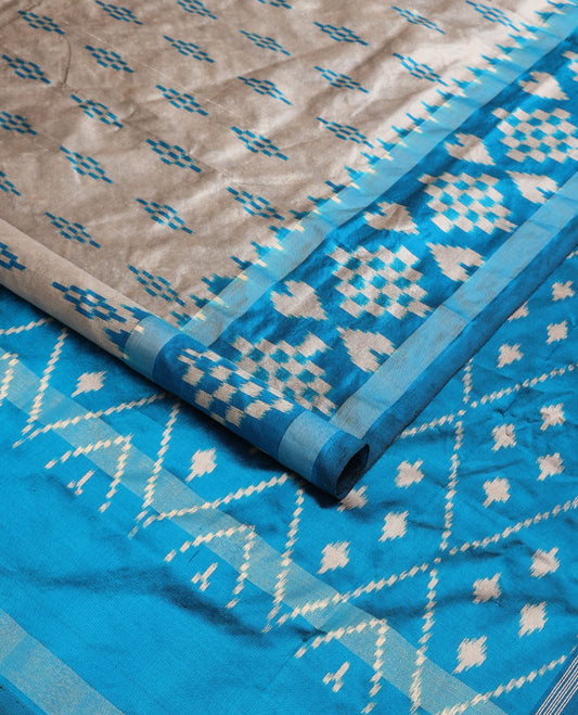 Grey ikkat saree with buttas, contrast ikkat border & pallu of jaal ikkat design