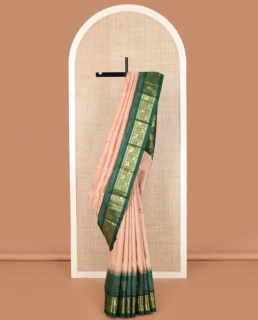 Peach zari buttas Kanchipuram silk saree, contrast one-sided thazampoo rekku checked border of salngai, banaras, mayil chakra and then kuli kann designs, and zari design pallu