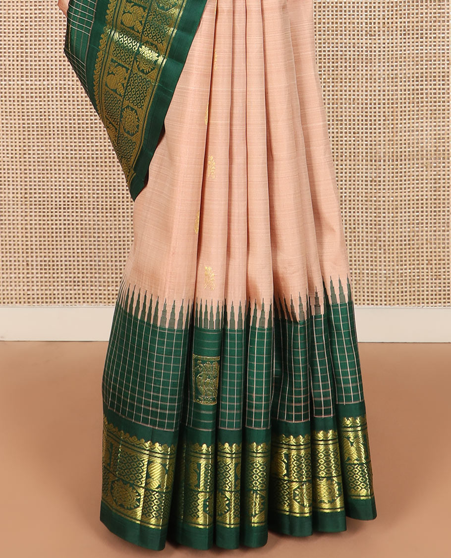 Peach zari buttas Kanchipuram silk saree, contrast one-sided thazampoo rekku checked border of salngai, banaras, mayil chakra and then kuli kann designs, and zari design pallu