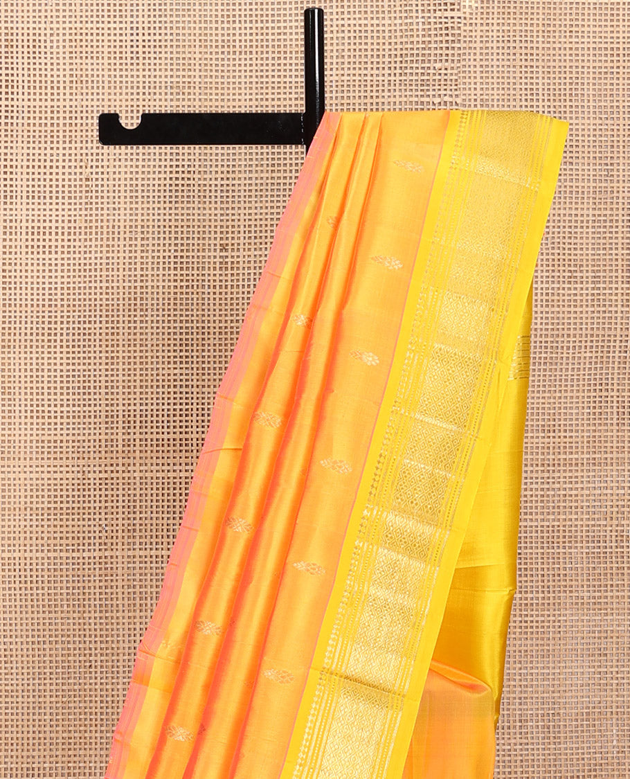 Yellow Kanchipuram Silk Saree, Subtly Sparkled with Zari Buttas, a Contrast One-Sided Border of Panner Sombu, Banaras, Muthu, and Jaal, Zari-Woven Pallu, and No Blouse