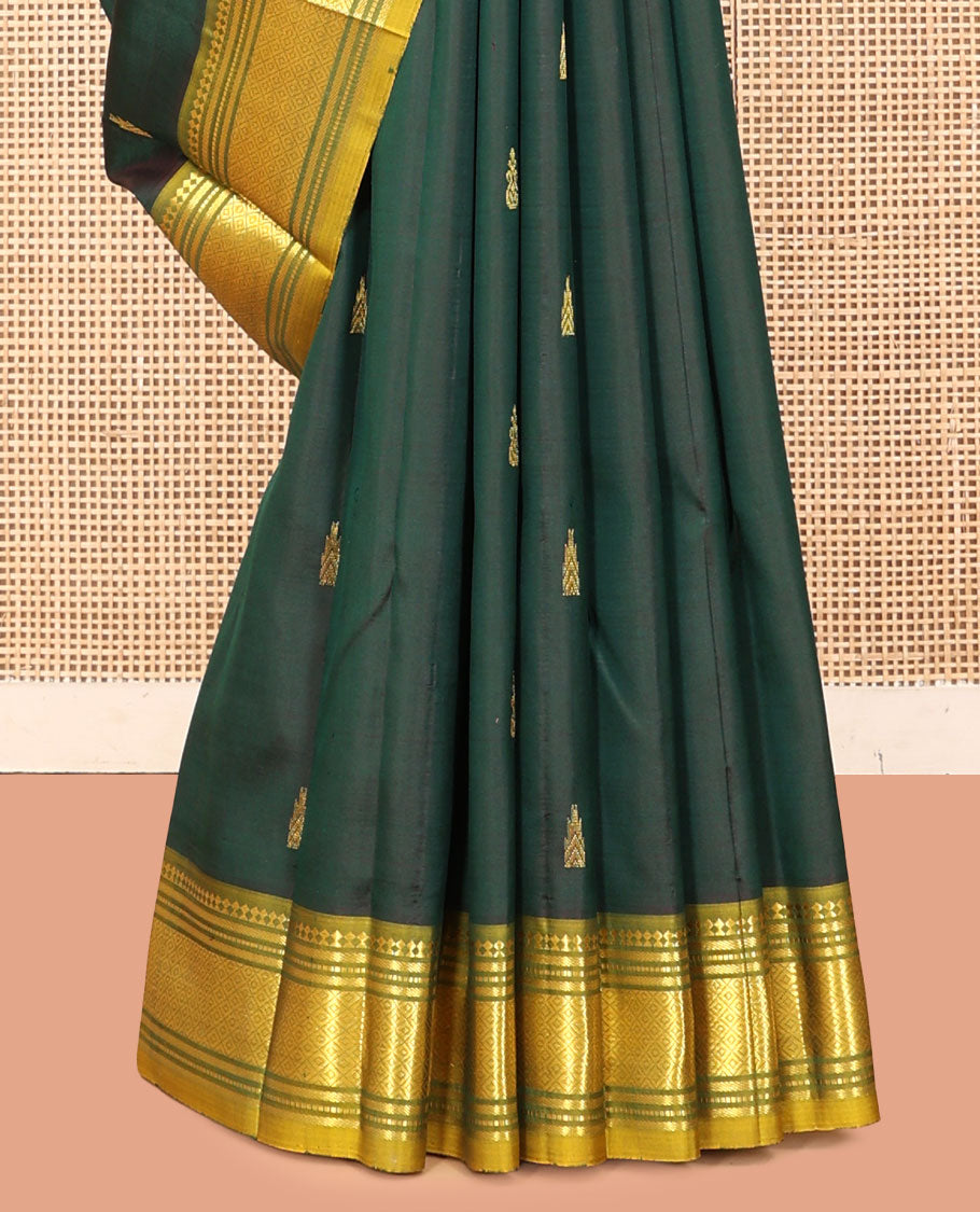Green Kanchipuram Silk Saree, Detailed with Zari Buttas, a Contrast One-Sided Border of Paneer Sombu, Banaras, Muthu, and Mayil Kann Designs, a Zari Design Pallu, and No Blouse