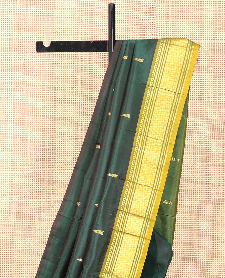 Green Kanchipuram Silk Saree, Detailed with Zari Buttas, a Contrast One-Sided Border of Paneer Sombu, Banaras, Muthu, and Mayil Kann Designs, a Zari Design Pallu, and No Blouse
