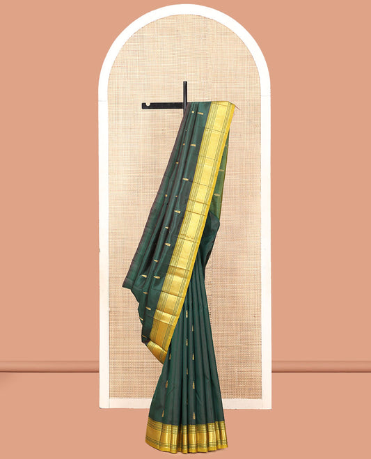 Green Kanchipuram Silk Saree, Detailed with Zari Buttas, a Contrast One-Sided Border of Paneer Sombu, Banaras, Muthu, and Mayil Kann Designs, a Zari Design Pallu, and No Blouse