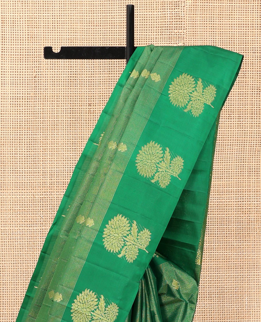 Green Kanchipuram Silk Saree, Woven with Zari Buttas and Stripes, Highlighted by a Zari Border of Floral Designs, Grand Jaal Pallu, and a Matching Blouse