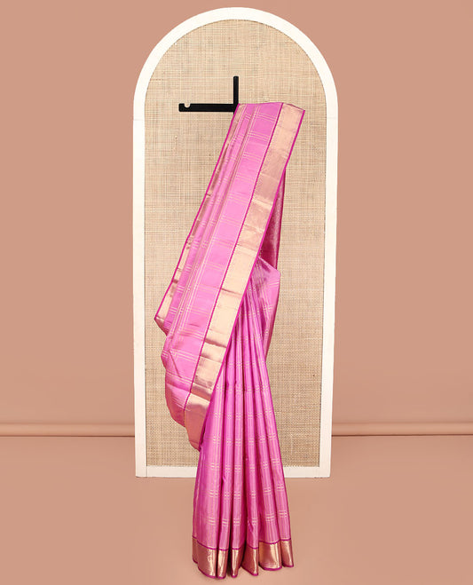 Pink Kanchipuram Silk Saree, Gleamed Up with Zari Checked Design on Its Body, Complemented by a Contrast Border of Manga, Rekku, Cross Kamalam, and Mayil Kann Designs, Grand Jaal Pallu, and Paired with a Contrast Blouse