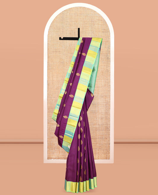 Purple Kanchipuram Silk Saree, Decked Up with Zari Buttas, a Contrast Korvai Manga Border, Intricate Pallu, and a Contrast Blouse
