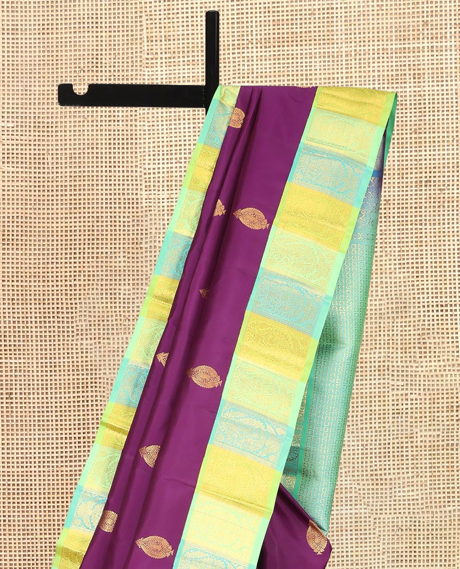 Purple Kanchipuram Silk Saree, Decked Up with Zari Buttas, a Contrast Korvai Manga Border, Intricate Pallu, and a Contrast Blouse