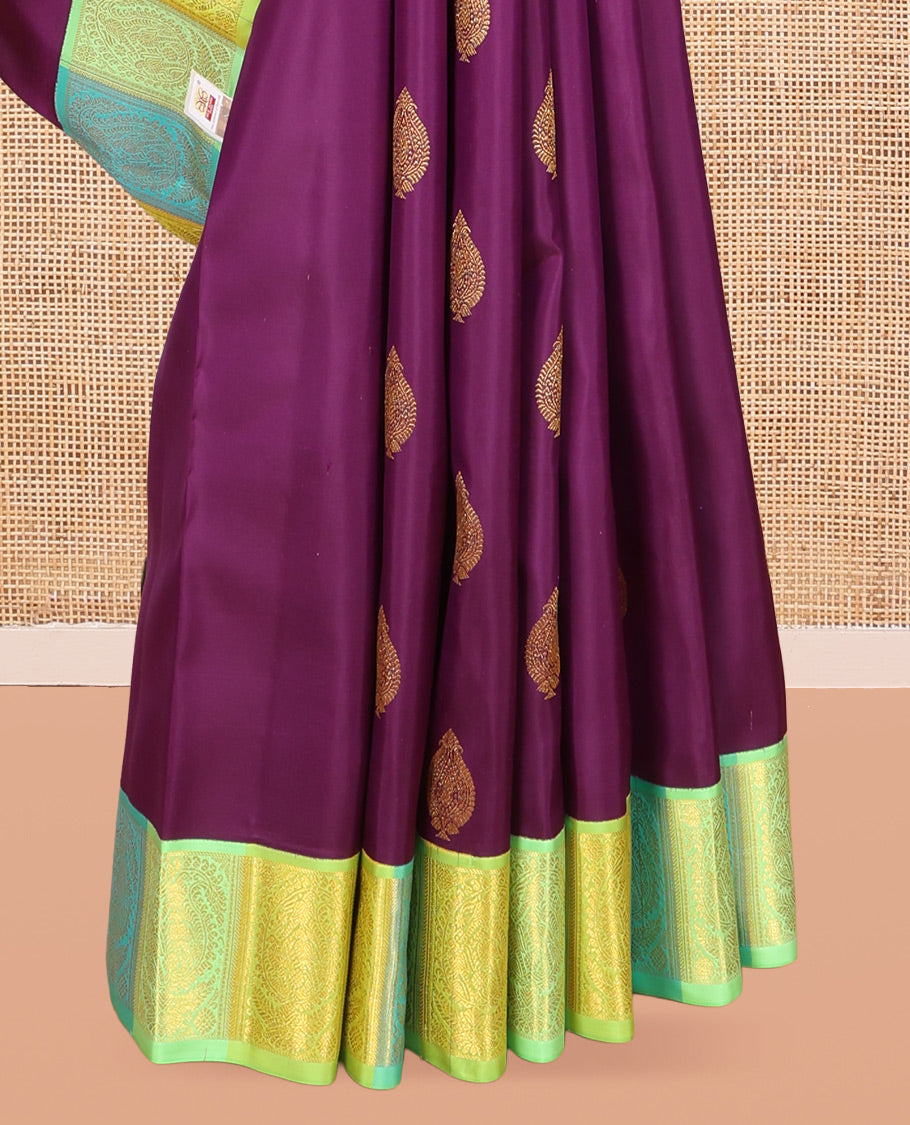 Purple Kanchipuram Silk Saree, Decked Up with Zari Buttas, a Contrast Korvai Manga Border, Intricate Pallu, and a Contrast Blouse