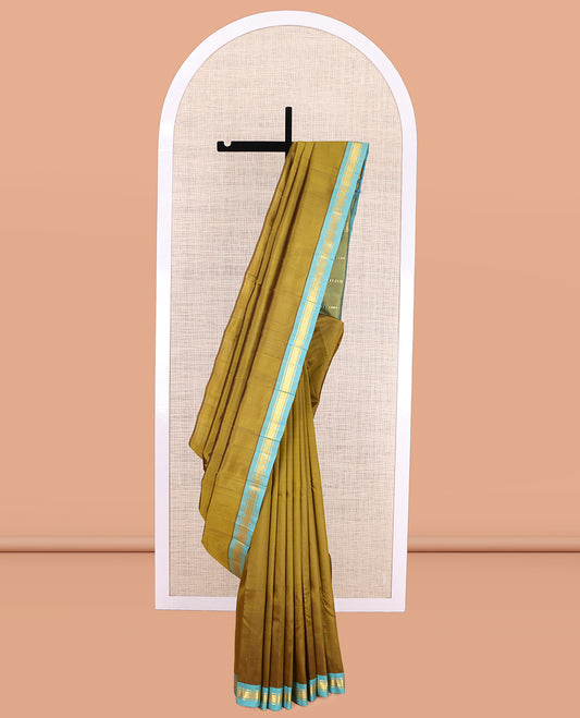 Green Plain Kanchipuram Silk Saree, a Contrast Zari One-sided Border, Zari Striped Pallu, and No Blouse