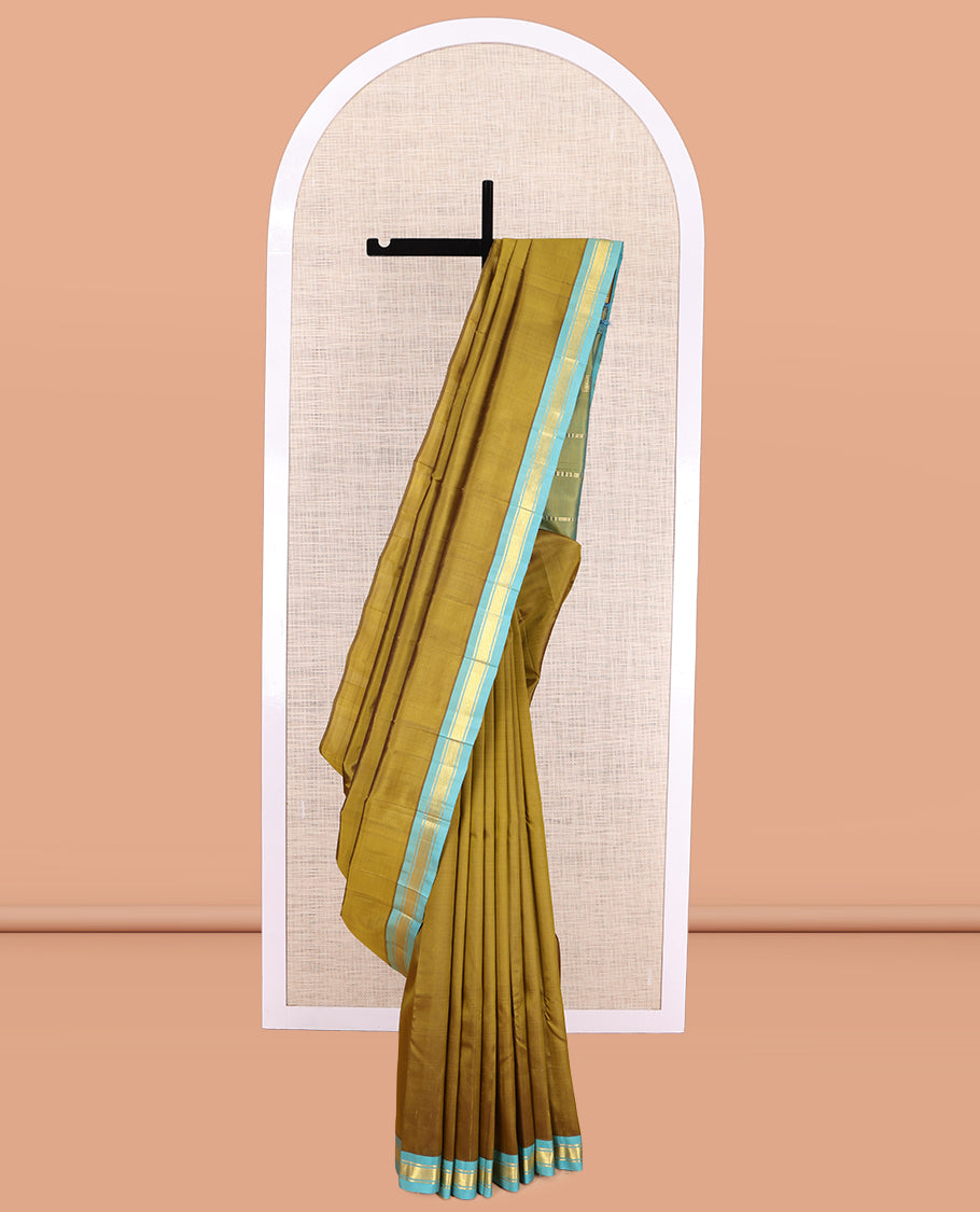 Green Plain Kanchipuram Silk Saree, a Contrast Zari One-sided Border, Zari Striped Pallu, and No Blouse
