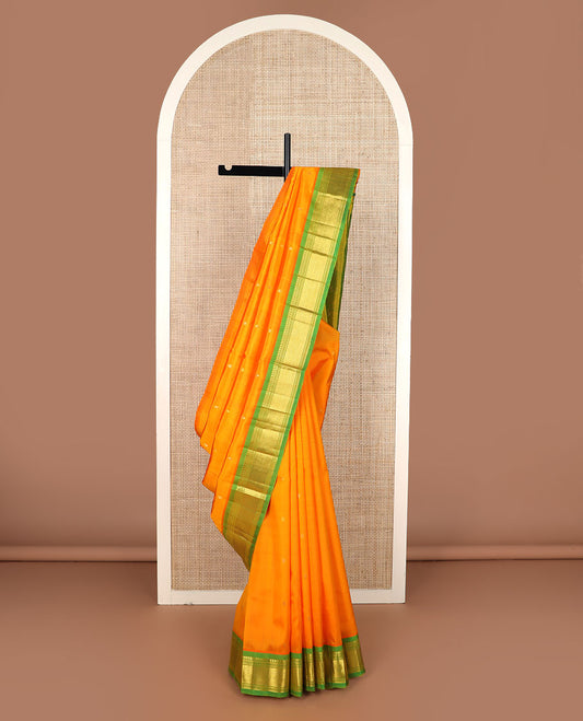 Orange zari buttas Kanchipuram silk saree, contrast border of panner sombu, banaras, muthu & mayil kann & zari design pallu