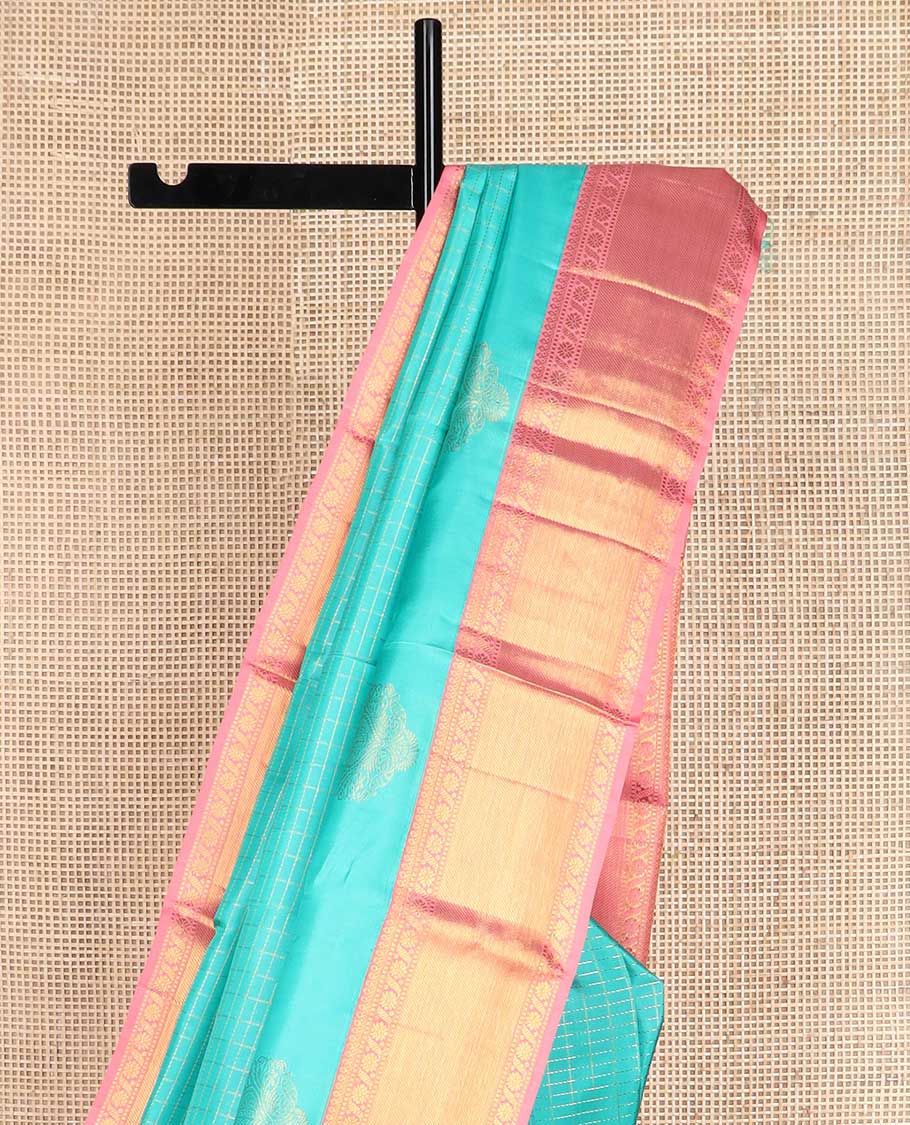 Blue zari buttas and checked Kanchipuram silk saree, contrast border of salngai, muthu, and cross kamalam designs, and jaal pallu