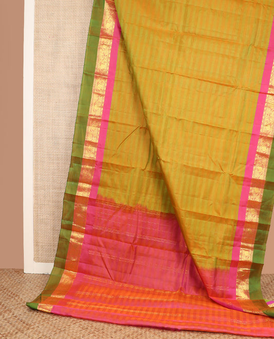 Green striped Kanchipuram silk saree, contrast border of rekku, kodi manga and mayil designs, and zari striped pallu