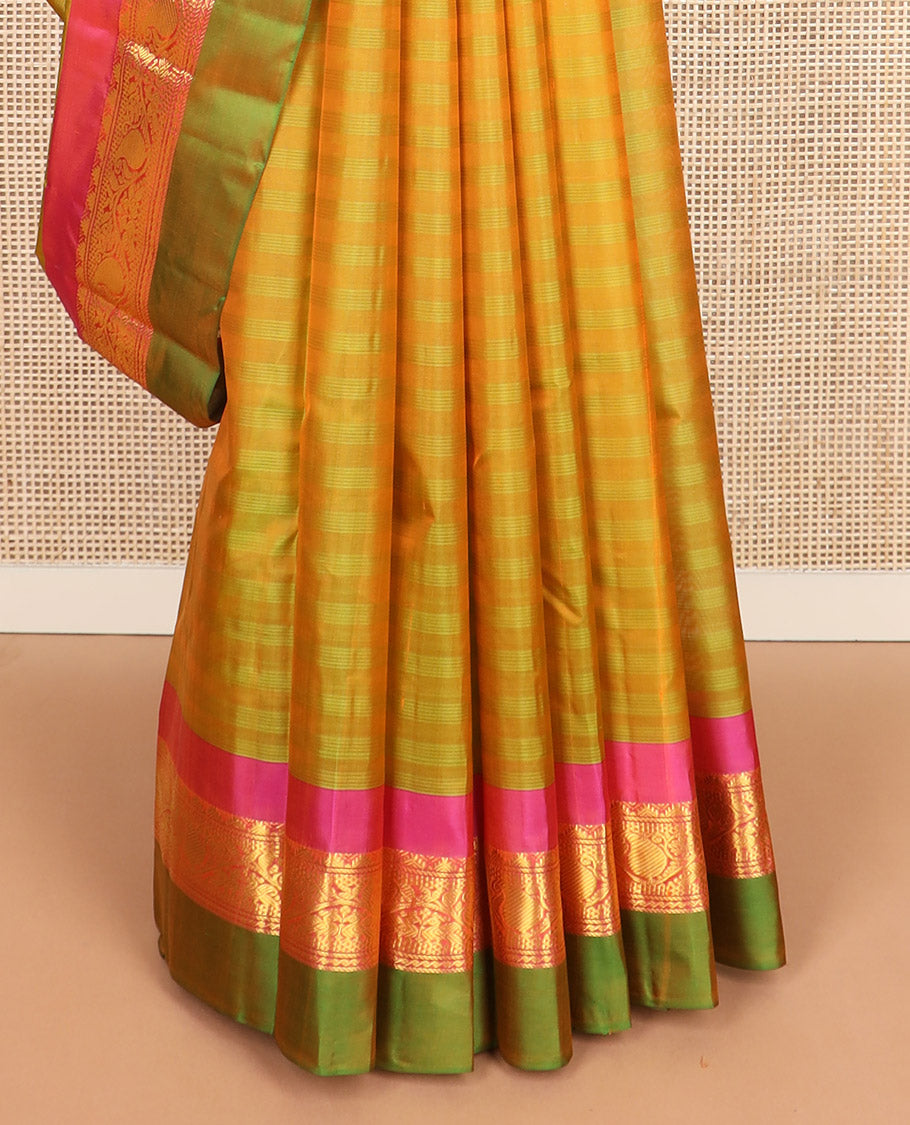 Green striped Kanchipuram silk saree, contrast border of rekku, kodi manga and mayil designs, and zari striped pallu