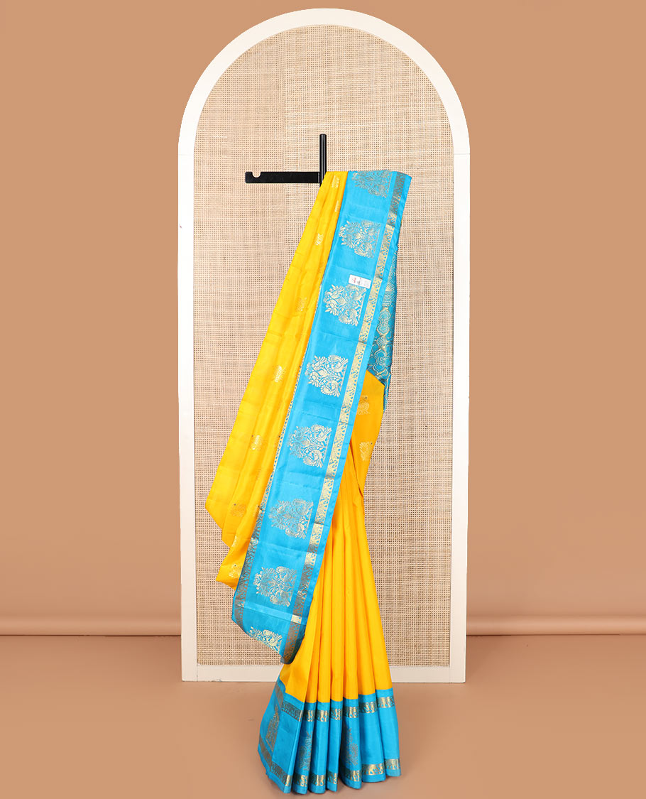 Yellow mayil buttas Kanchipuram silk saree, contrast border of yaanai, and mayil designs, and pallu of floral designs