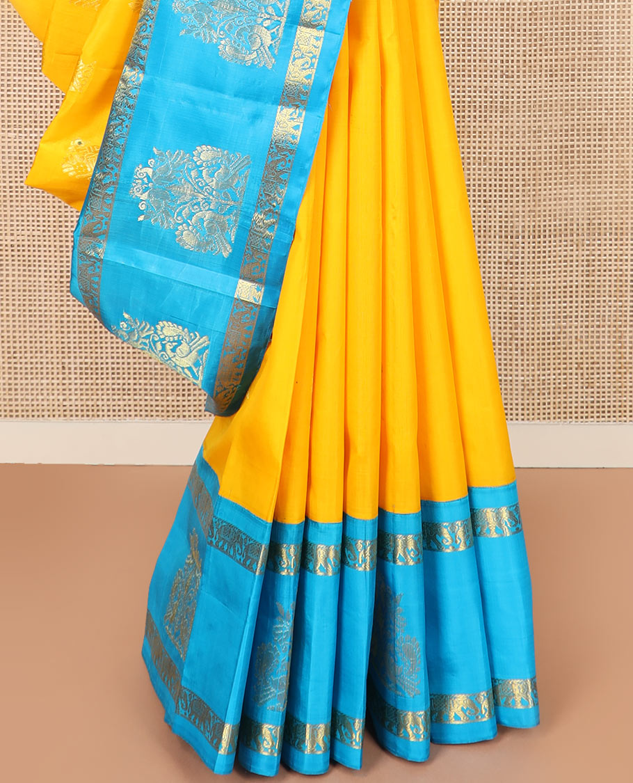Yellow mayil buttas Kanchipuram silk saree, contrast border of yaanai, and mayil designs, and pallu of floral designs