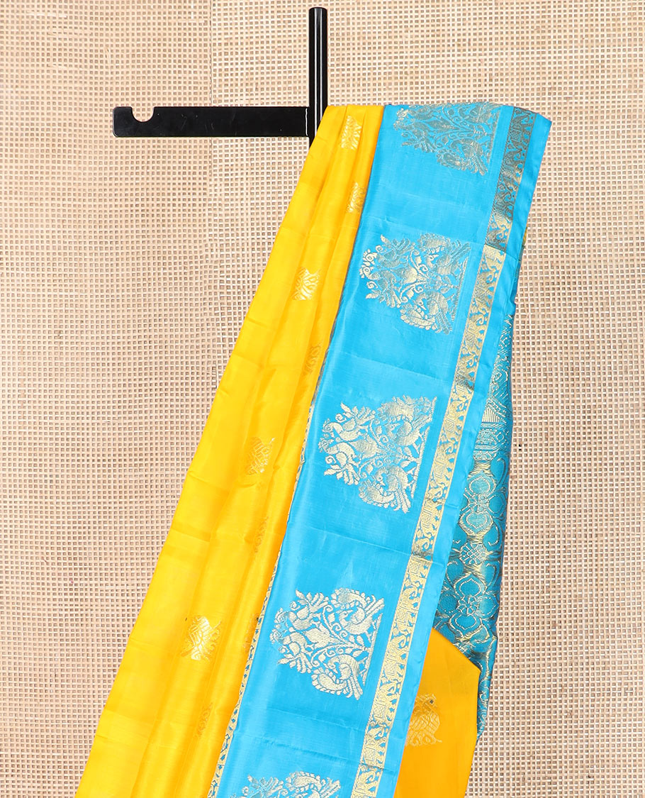 Yellow mayil buttas Kanchipuram silk saree, contrast border of yaanai, and mayil designs, and pallu of floral designs