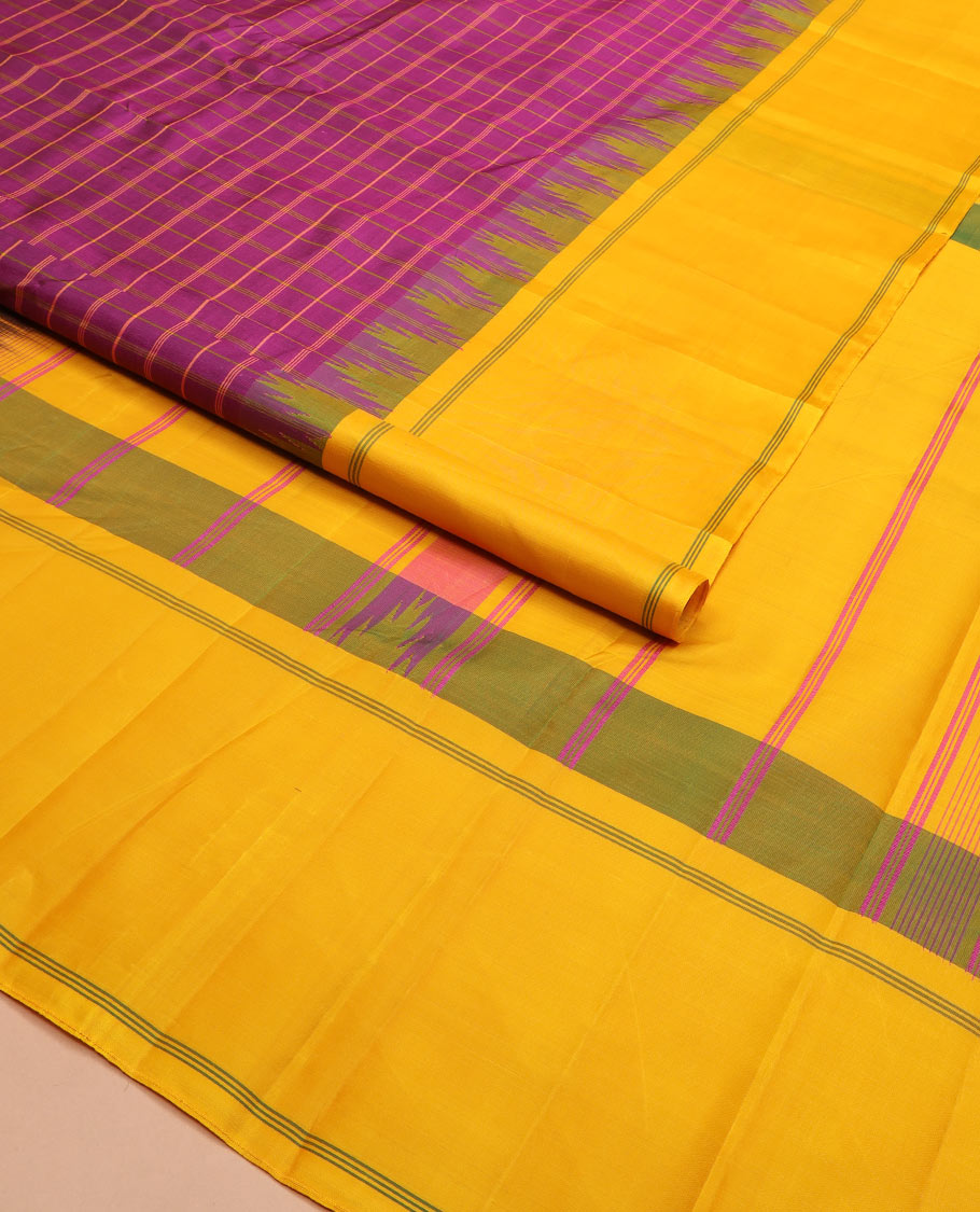 Purple checked Kanchipuram silk saree, contrast thazampoo rekku striped border, and striped pallu