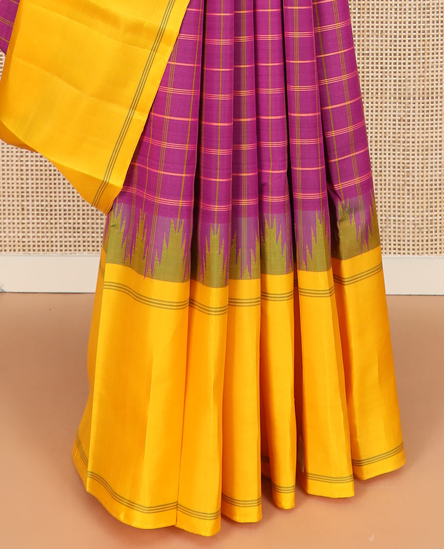 Purple checked Kanchipuram silk saree, contrast thazampoo rekku striped border, and striped pallu