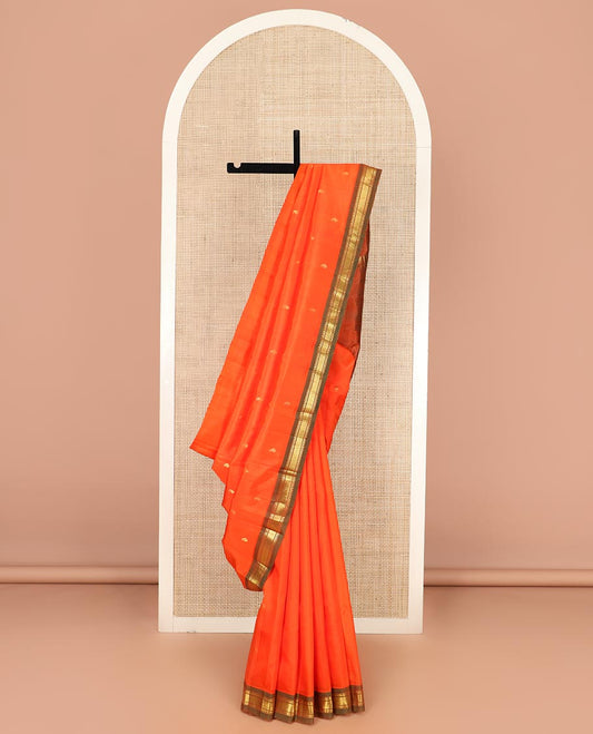 Orange Kanchipuram Silk Saree Mesmerized with Zari Buttas All Over Its Body, Complemented by a Contrast One-Sided Border of Rekku, Banaras, and Mayil Kann Designs, Pallu of Zari Stripes, and Comes Without a Blouse