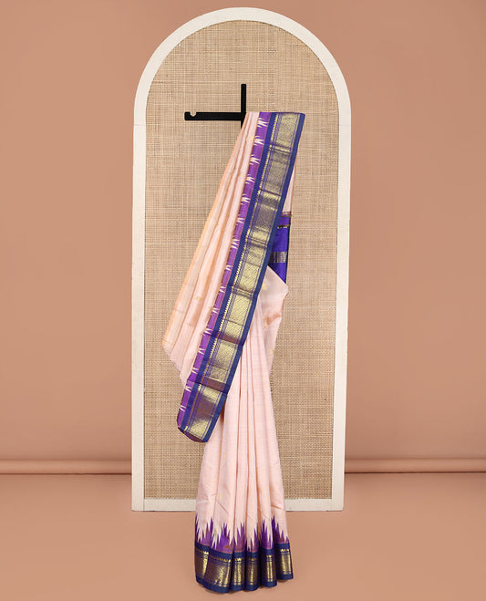 Light Peach Kanchipuram Silk Saree, Subtly Sparkled with Zari Buttas, Complemented by Contrast One-Sided Border of Thilakam Mokku, Banaras, and Godhumai Designs, Pallu of Zari Designs, and Comes Without a Blouse
