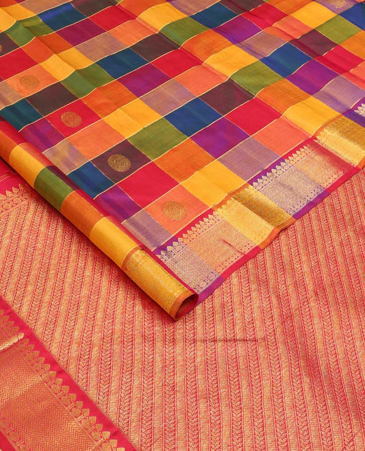 Multi-color paalum pazhamum checked annam chakram buttas Kanchipuram silk saree, zari border of thilakam mokku, rudraksham and vanki designs, and leaf vine pallu