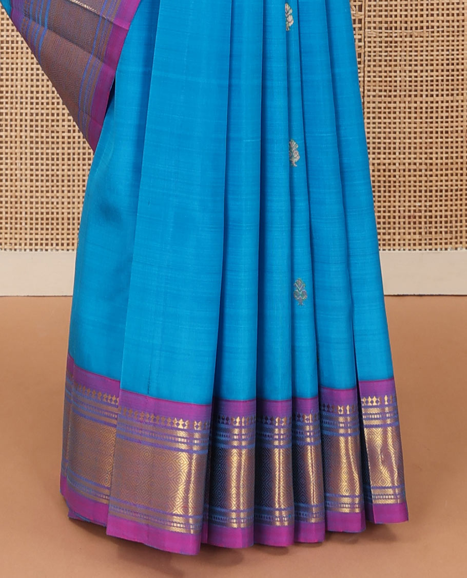 Aszure blue zari buttas Kanchipuram silk saree, contrast one-sided border of panner sombu, muthu, banaras, and jaal, and zari design pallu