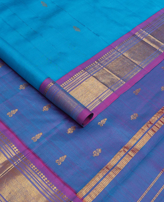 Aszure blue zari buttas Kanchipuram silk saree, contrast one-sided border of panner sombu, muthu, banaras, and jaal, and zari design pallu