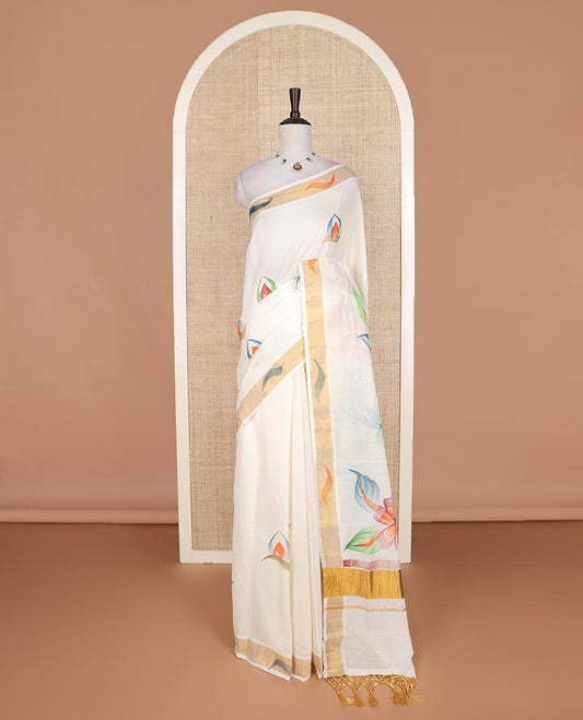 Cream hand brush painting style floral motifs printed Kerala cotton saree, zari and dyed border, and hand brush painting pallu