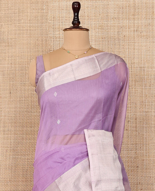 Lavender Maheshwari Cotton Saree, Woven with Buttas All Over Its Body, Complemented by a Contrast Traditional Design Border of Chevron Stripes, Pallu of Buttas, and Paired with a Matching Blouse