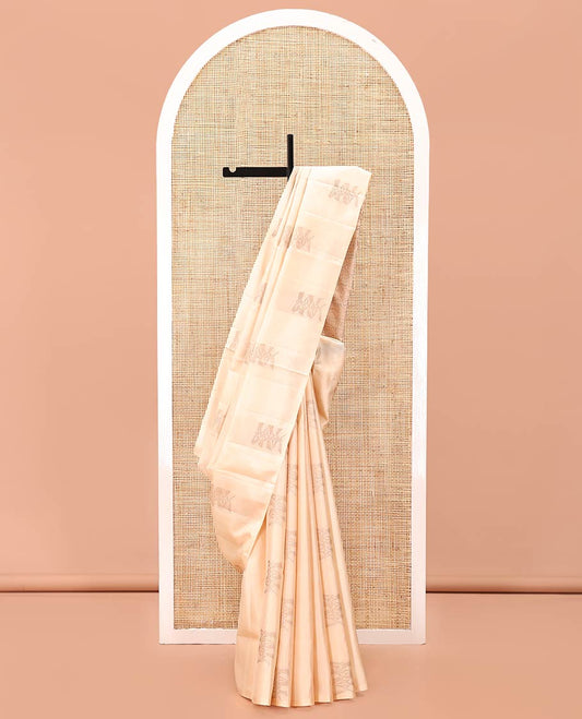 Borderless Cream Mayuri Soft Silk Saree, Subtly Sparkled With Buttas All Over Its Body, Highlighted by Pallu of Intricate Design Weave, and Paired with a Matching Blouse