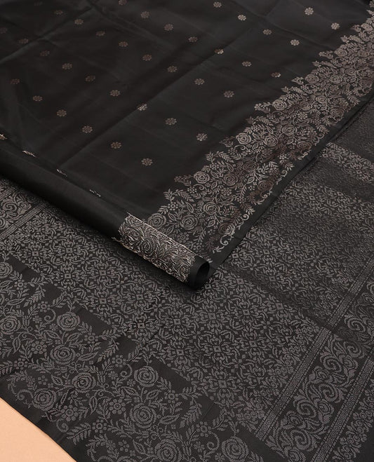 Black Mayuri Soft Silk Saree Gleamed Up with Floral Zari Buttas Across Its Body, Highlighted by Zari Border of Floral Jaal Designs, Pallu Featuring Intricate Design Weave, and Paired with a Matching Blouse