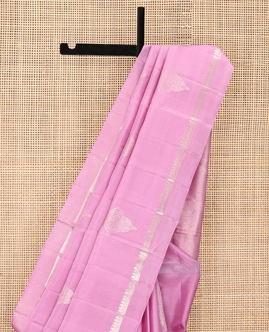 Pink Mayuri Soft Silk Saree, Embellished with Buttas All Over Its Body, Subtly Sparkled Kal Erangina Border of Thilakam Mokku Designs, Intricately Woven Pallu of Chevron Designs, and Paired with a Matching Blouse