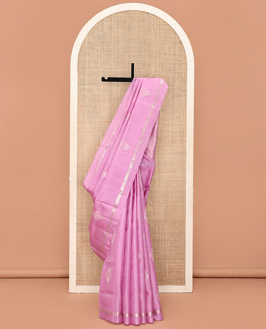 Pink Mayuri Soft Silk Saree, Embellished with Buttas All Over Its Body, Subtly Sparkled Kal Erangina Border of Thilakam Mokku Designs, Intricately Woven Pallu of Chevron Designs, and Paired with a Matching Blouse