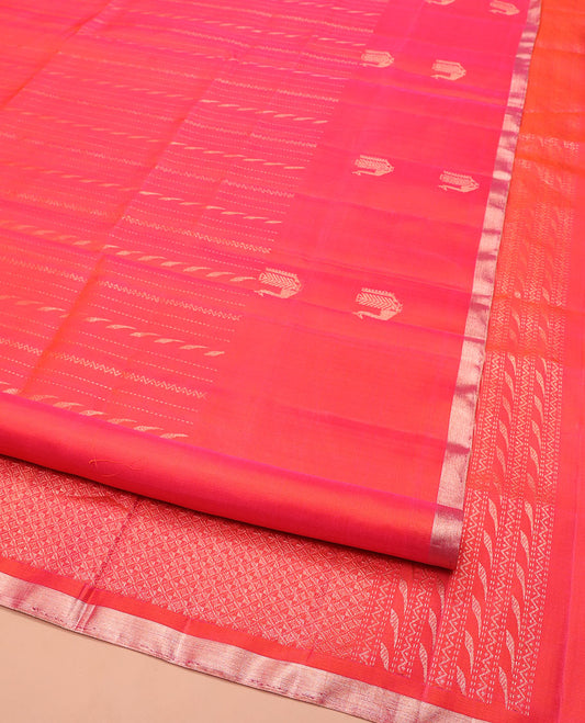 Orange Mayuri Soft Silk Saree, Mesmerized with Neli, and Muthu Designs All Over Its Body, Highlighted by Zari Border of Peacock Designs, Boldly Accentuated Jaal Pallu, and Paired with a Matching Blouse