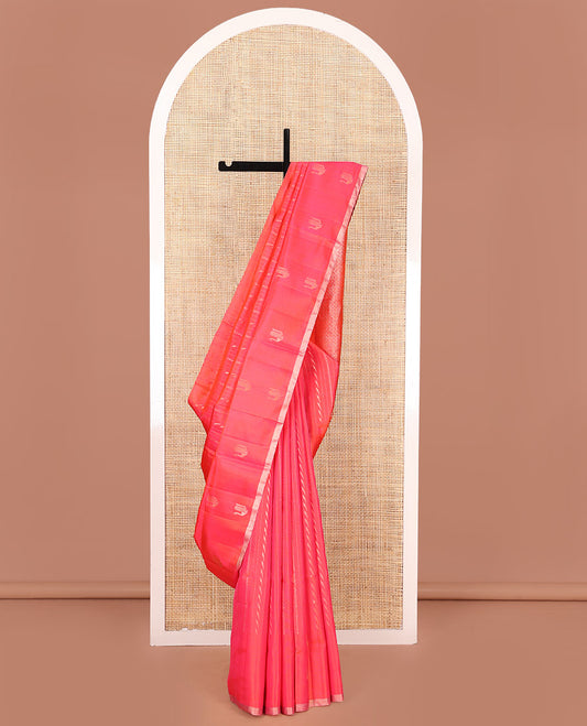 Orange Mayuri Soft Silk Saree, Mesmerized with Neli, and Muthu Designs All Over Its Body, Highlighted by Zari Border of Peacock Designs, Boldly Accentuated Jaal Pallu, and Paired with a Matching Blouse